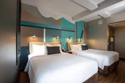 two beds in a hotel room with white sheets at Fairfield Inn & Suites by Marriott Philadelphia Downtown/Center City in Philadelphia