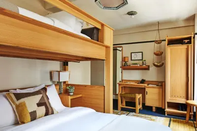 a bedroom with a bunk bed and a desk at Freehand New York in New York