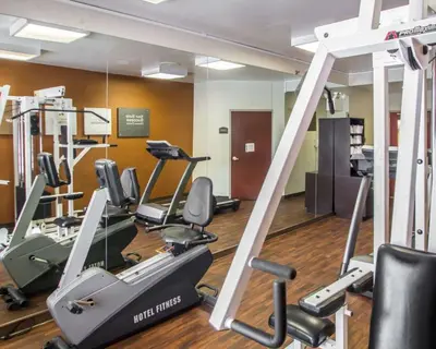 a gym with treadmills and elliptical machines at Quality Suites NYC Gateway in North Bergen