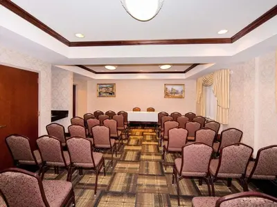 a room with a bunch of chairs in it at Quality Suites NYC Gateway in North Bergen