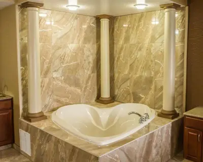 a bathroom with a white sink in a marble counter at Quality Suites NYC Gateway in North Bergen