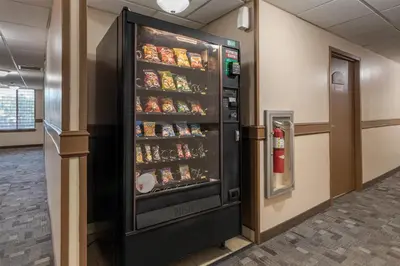 a refrigerator filled with food in a room at SureStay Hotel by Best Western East Brunswick in East Brunswick
