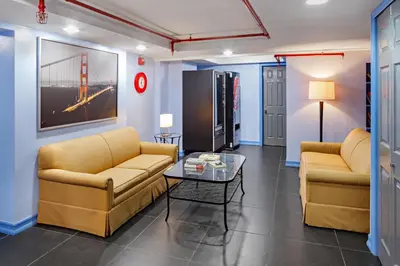 a living room with two couches and a table at Central Park West Hostel in New York