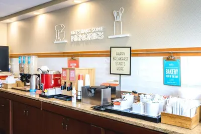 a coffee shop with a counter with a coffee maker at Hampton Inn Downingtown/Exton in Exton