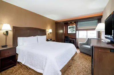 a hotel room with a bed and a television at Hampton Inn Downingtown/Exton in Exton