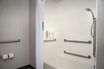 a bathroom with a shower and a toilet and a sink at Hampton Inn Easton in Easton