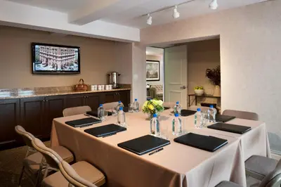 a conference room with a long table with chairs at Hotel Lucerne in New York