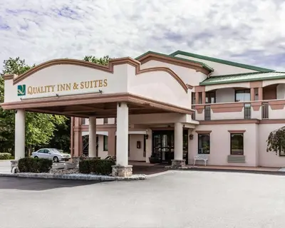 a building with a sign that reads outpatient inn and suites at Quality Inn & Suites Quakertown-Allentown in Quakertown