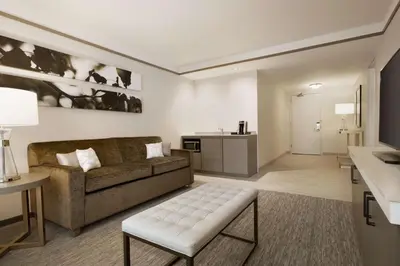 a living room with a couch and a table at Hilton Garden Inn Newtown Square Radnor in Newtown Square