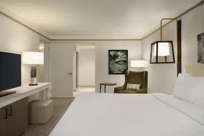 a hotel room with a large bed and a desk at Hilton Garden Inn Newtown Square Radnor in Newtown Square