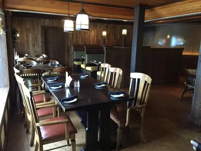a dining room with a long table and chairs at Heritage Hotel Lancaster in Lancaster