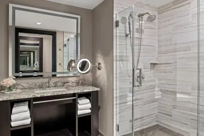a bathroom with a shower and a sink at Mount Airy Casino Resort - Adults Only 21 Plus in Mount Pocono