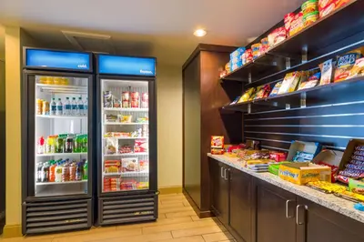a store with an open refrigerator with food inside at Hampton Inn Danville in Danville
