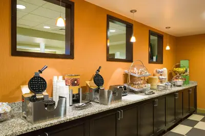 a kitchen with a counter with food on it at Hampton Inn Danville in Danville