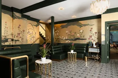 a lobby with green furniture and floral wallpaper at The Franklin on Rittenhouse, A Boutique Hotel in Philadelphia