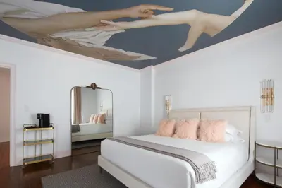 a bedroom with a bed with a painting on the ceiling at The Franklin on Rittenhouse, A Boutique Hotel in Philadelphia