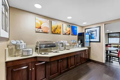 a kitchen with a counter with a coffee maker at Comfort Inn & Suites Somerset - New Brunswick in Somerset