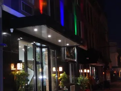 a store with colorful lights on the side of a building at Quality Inn near Sunset Park in Brooklyn