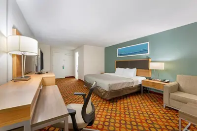 a hotel room with a bed and a desk at Quality Inn Enola - Harrisburg in Harrisburg
