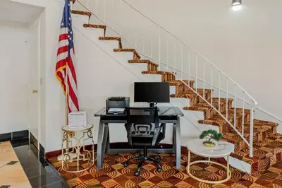 an office with a desk with a computer and a staircase at Quality Inn Enola - Harrisburg in Harrisburg