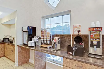 a counter in a fast food restaurant with aperature at Howard Johnson by Wyndham Blackwood Near Philadelphia in Blackwood