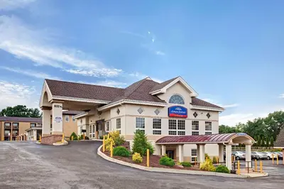 a hotel front of a building with a parking lot at Howard Johnson by Wyndham Blackwood Near Philadelphia in Blackwood