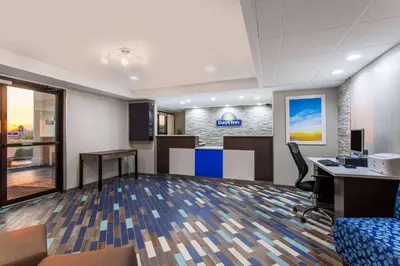 an office with a lobby with a desk and chairs at Days Inn by Wyndham Wilmington Brandywine in Talleyville