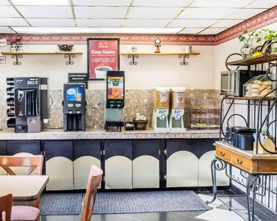 a fast food restaurant with a counter with a cash register at Econo Lodge Scranton near Montage Mountain in Scranton