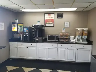 a counter with coffee machines and other items on it at Econo Lodge Scranton near Montage Mountain in Scranton