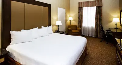 a large white bed in a hotel room at Heritage Hills Golf Resort & Conference Center in York