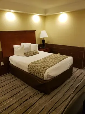 a bedroom with a large bed in a hotel room at Baymont by Wyndham Pompton Plains/Wayne in Pompton Plains