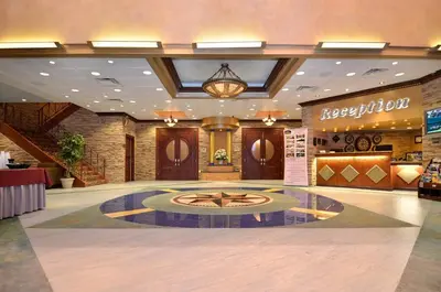 a lobby of a hotel with a reception area at Baymont by Wyndham Pompton Plains/Wayne in Pompton Plains