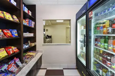 a store aisle of a grocery store with food at Hampton Inn Clinton in Clinton