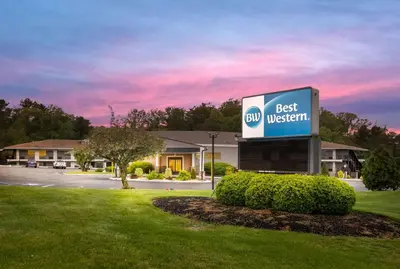 a best western sign in front of a building at Best Western Bordentown Inn in Bordentown