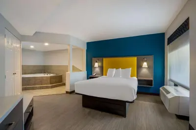 a hotel room with a bed and a bath tub at Best Western Bordentown Inn in Bordentown