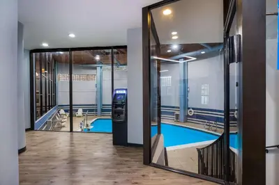 a view of a pool through a glass door at Best Western Bordentown Inn in Bordentown