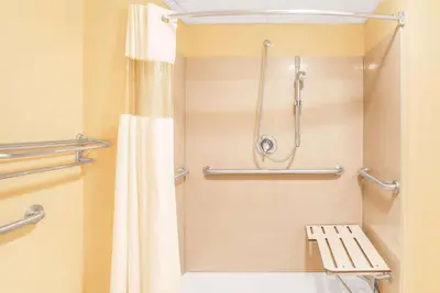 a bathroom with a shower and a toilet at Knights Inn Mount Laurel in Mount Laurel