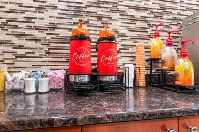 a counter with coca cola bottles on it at Econo Lodge Woodbridge in Iselin