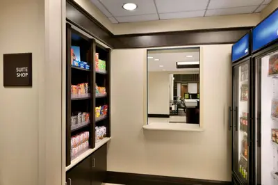 a pharmacy aisle with a self shop sign in a store at Hampton Inn & Suites Mahwah in Mahwah