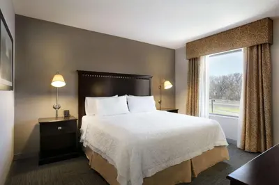 a hotel room with a bed and a window at Hampton Inn & Suites Mahwah in Mahwah