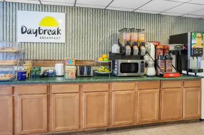 a kitchen with a counter with a microwave at Days Inn by Wyndham Wilkes Barre in Wilkes-Barre