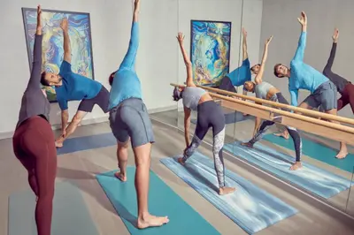 a group of people doing yoga in a room at Artezen Hotel in New York