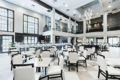 a dining room with white tables and chairs at Hampton Inn & Suites Fairfield in Fairfield