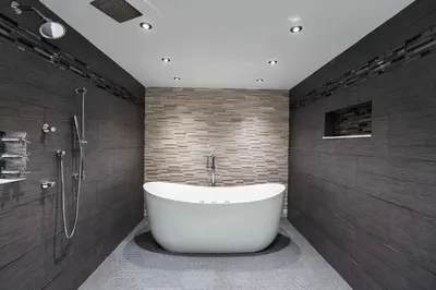a bathroom with a white tub and a shower at Hampton Inn & Suites Fairfield in Fairfield