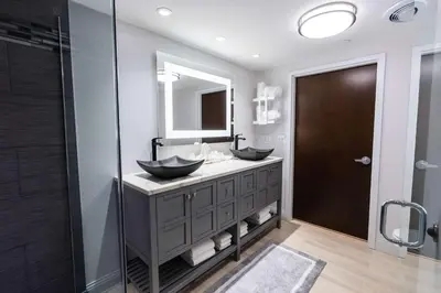 a bathroom with two sinks and a mirror at Hampton Inn & Suites Fairfield in Fairfield