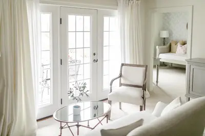 a living room with a couch and a glass table at Fairville Inn in Chadds Ford