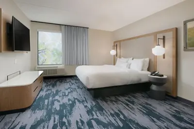 a hotel room with a large bed and a window at Fairfield Inn & Suites by Marriott Pottstown Limerick in Pottstown