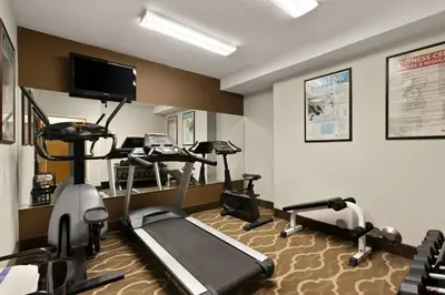 a room with a gym with tread machines and a treadmill at Comfort Inn Bordentown near NJ Turnpike in Bordentown