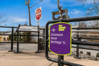 a purple sign on the side of a bus stop at Comfort Inn Bordentown near NJ Turnpike in Bordentown