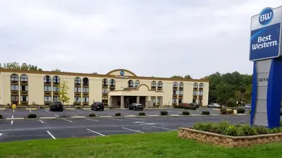 a hotel with a parking lot in front of it at Best Western Hazlet Inn in Hazlet